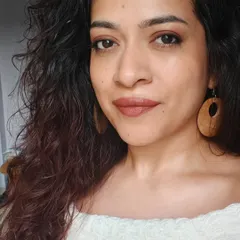 A soft, natural makeup look with a warm, earthy-toned lipstick and defined eyes. This is a perfect example of an everyday glam that enhances your features.