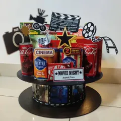 Lights, camera, action! This Bollywood-themed hamper is perfect for a movie lover. It's designed to look like a film reel and is filled with movie night essentials like popcorn, Coca-Cola, and KitKats.