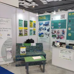 Another angle of our setup at PLAST INDIA 2023, showing our information panels that explain our mission, product range, and recycling process.