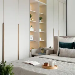 My work is about creating furniture that fits your life. This bedroom shows a fully integrated wall unit, combining a seamless wardrobe with a built-in bedside shelf and display niche, keeping the room feeling open and serene.