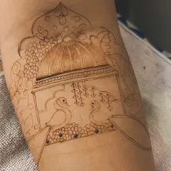 This is the first step: the outline. Here you can see the initial sketch of a royal scene with two peacocks in a jharokha before the intricate filling work begins.
