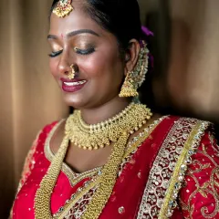 A close-up of the eye makeup, a shimmery gold that makes her eyes sparkle.