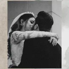 A close-up, black and white shot of the couple sharing a kiss. This timeless style emphasizes the emotion and intimacy of the moment.