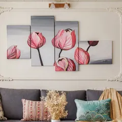 Art can also be soft and serene. This multi-panel painting of pink tulips adds a touch of modern romance above the sofa, its gentle colors complementing the cool tones of the cushions.