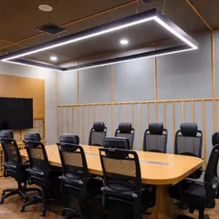 This conference room at Anthea Pharma showcases our focus on creating unique, acoustically optimized spaces. The design features a traditional chattayi ceiling with teakwood beading, herringbone wooden flooring, and patterned acoustical boards on the walls for a warm and sophisticated feel.