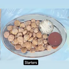 A platter of one of our specialty starters, ready to be served with dipping sauce and toothpicks for easy eating.