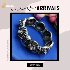 A beautifully detailed oxidized silver bangle with floral and dome motifs. This is a classic piece of tribal-inspired jewellery that is both bold and intricate.