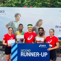 Team Trackblazers on the podium after securing the second runner-up position at the Asics Gel Kayano 31 relay event. Our team of three competed against 45 other teams to earn this spot.