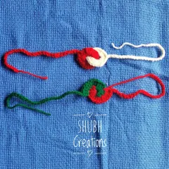 Two minimalist crochet rakhis in red and green, featuring a simple spiral design.