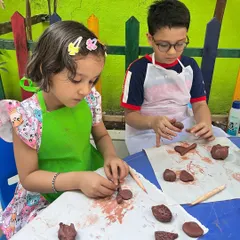 Collaboration is a natural part of our workshops. Here, two young artists work side-by-side on their clay models, sharing ideas and learning together in a supportive and friendly atmosphere.