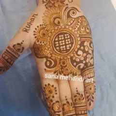 A lovely single-hand design with a central mandala and the name 'Ruhan' written on the side. This is a great option for a quick and beautiful festive touch.