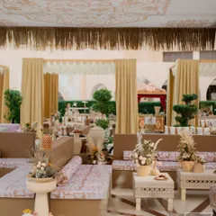For a wedding in Doha, we brought a contemporary souq experience to life. This lounge area features handcrafted textiles, artisanal florals, and traditional spices, all chosen to complement the eclectic Middle Eastern mood.