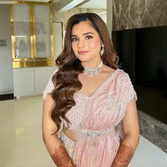 Soft glam for a beautiful engagement bride. This look features a flawless matte base with a touch of pink on the eyes and cheeks, paired with classic soft waves for an elegant and timeless feel.