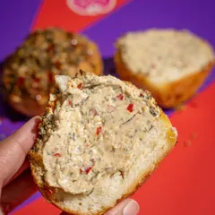 A cross-section of our Hot Garlic Bun, showing off that generous, creamy filling. It’s the perfect balance of soft, rich, spicy, and deeply satisfying.