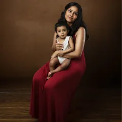 A slightly different pose from the same session, with the mother seated. This shows the versatility within a single session to create a variety of beautiful images for your gallery wall.