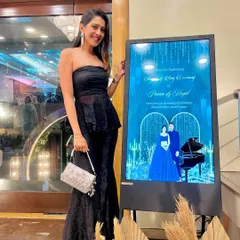 This digital welcome board for a Sangeet and Ring Ceremony looks so sleek. The design has a "Starry Night" theme with a deep blue background, piano illustration, and a glamorous caricature of the couple.