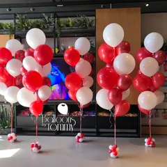 Simple yet effective, these classic red and white balloon bunches are perfect for grand openings, sales events, or product launches. They are a cost-effective way to fill a space with color and draw attention to your brand.