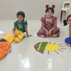 Another group of happy campers with their beautiful Pookalam. These creative projects are a key part of our summer fun, encouraging teamwork and artistic expression.