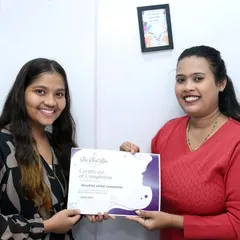A happy moment with my student as she receives her certificate. I wish her all the success in her new career as a nail artist.
