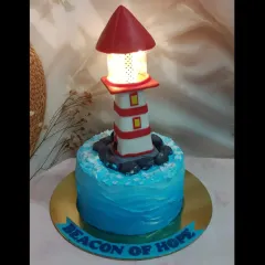 A beacon of hope, and a delicious cake. This lighthouse cake features a working light at the top, making it a unique and symbolic centerpiece.