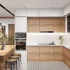 A classic combination of wood and white makes this kitchen feel bright and spacious. The design includes a tall unit for a built-in oven and microwave, creating a seamless look.