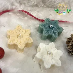 Here is a trio of my snowflake candles, showing the different colors available. Each one is delicately crafted to capture the beauty of a winter snowflake.