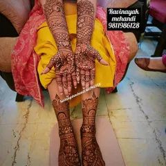 This bride is ready for her big day with full mehndi on her hands and feet. The designs are rich with traditional patterns, providing heavy coverage for a classic bridal aesthetic.