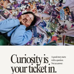 Curiosity is your ticket in. This image of a woman surrounded by old photographs represents my belief that every great story begins with a question, not an answer.