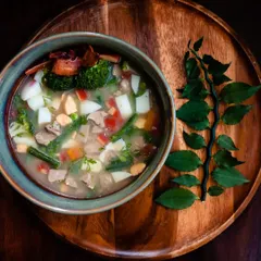 My special Paaya soup is slow-cooked overnight to create a rich, gelatinous bone broth. I load it with fresh vegetables, tender meat, and liver, making it an incredibly nutritious and comforting meal, especially for older dogs or those needing extra hydration.