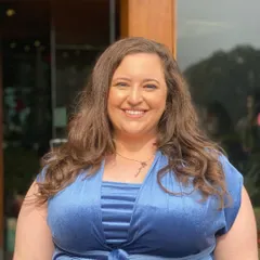 A close-up of the client, showing her radiant smile and the fresh, clean makeup that gives her a youthful glow.