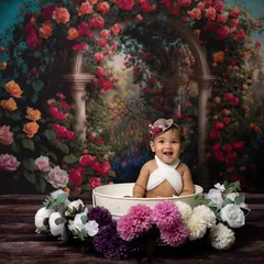 A beautiful, wide-angle shot showing the full floral bath setup against a romantic rose garden backdrop.