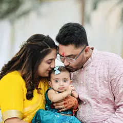 A quiet moment of love between new parents and their baby. We focus on capturing these gentle, unscripted family bonds during our naming ceremony and family photoshoots in Mumbai.