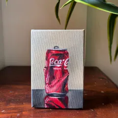 A realistic oil painting of a crushed Coca-Cola can, focusing on the way light reflects off the crumpled metal. It's a fun study in realism and pop art.