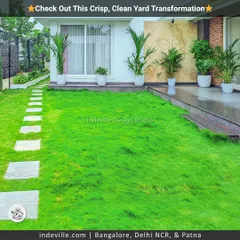 A crisp and clean backyard transformation. I laid a lush green lawn and created a simple stone path, complemented by minimalist white planters along the house for a modern and uncluttered look.