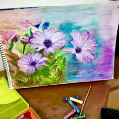 Exploring the rich, blendable textures of oil pastels is a favorite in our "Fundamentals of Fine Arts for Adults" online course. This beautiful floral piece shows the vibrant results you can achieve as you learn about layering and shading.