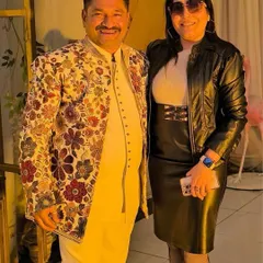 This photo shows the client enjoying his event in my floral jacket. Renting an outfit like this allows you to wear something bold and memorable for a special occasion without committing to a purchase.