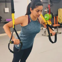 Strength training is for everyone. Here, I am demonstrating a TRX push-up, a fantastic exercise for building core and upper body strength safely and effectively.
