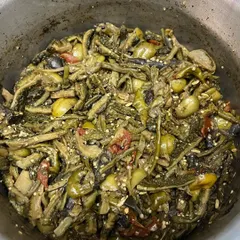 A large pot of 'Rusep' being prepared in our kitchen. Even though we are known for our pork, we love our vegetables and are excited to share this authentic wild veggie dish with you.