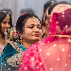 A mother's emotional expression during her daughter's Bidai. Capturing the feelings of the family is a key part of telling the whole wedding story.
