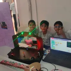 Meet the 'Techno Team', winners of the FLL Core Value Award. Their project, featuring a block-based coding interface on the laptop, demonstrates exceptional teamwork and enthusiasm. They proved that together, you can achieve more.