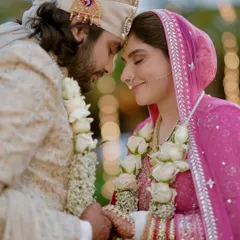An intensely romantic close-up of the couple, their foreheads touching. This image is all about the raw emotion and deep connection between two people in love.