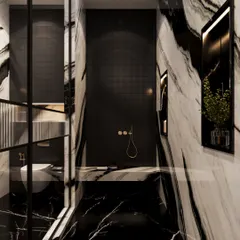 The shower area is a cocoon of black tiles and dramatic marble, creating a dark and intimate atmosphere. The brass fixtures provide a warm, luxurious contrast.