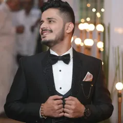 A closer look at the lapel work on this custom tuxedo. The texture and shine are designed to make the groom's outfit unique.