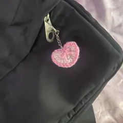 This is my pink crochet heart charm with a little bow detail. It's perfect for adding a soft, girly touch to your keys or bag.