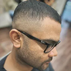 Another angle of the skin fade crew cut, showing the seamless blend from the top down. This cut is clean, low-maintenance, and requires precise clipper work to get right.