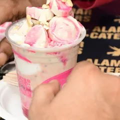 A delicious Falooda from our dessert partner, Hajoori's. It's a refreshing mix of milk, vermicelli, basil seeds, and ice cream, perfect for cooling down.