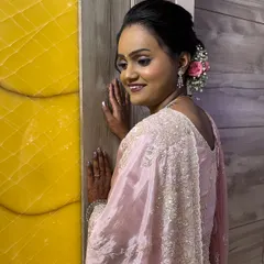 My reception bride Shivani, looking radiant in a soft pink saree. The makeup is dewy and fresh, with a simple yet elegant updo.