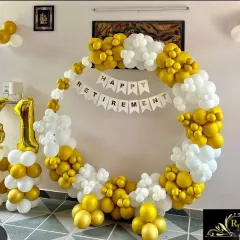 A retirement party marks a significant milestone. I created this cheerful setup with a white and gold balloon ring, a custom banner, and large foil balloons to honor a colleague's 41 years of dedication.