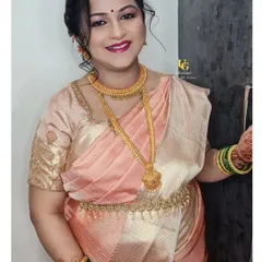 A stunning portrait of Shweta, showcasing her flawless baby shower makeup. The soft smokey eye and berry lip color enhance her joyful expression.