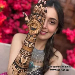 A happy bride is my biggest reward. Here, you can see the beautiful blend of traditional motifs like elephants and jharokhas with intricate patterns. This is a perfect example of a royal bridal mehndi design that looks stunning in photos.